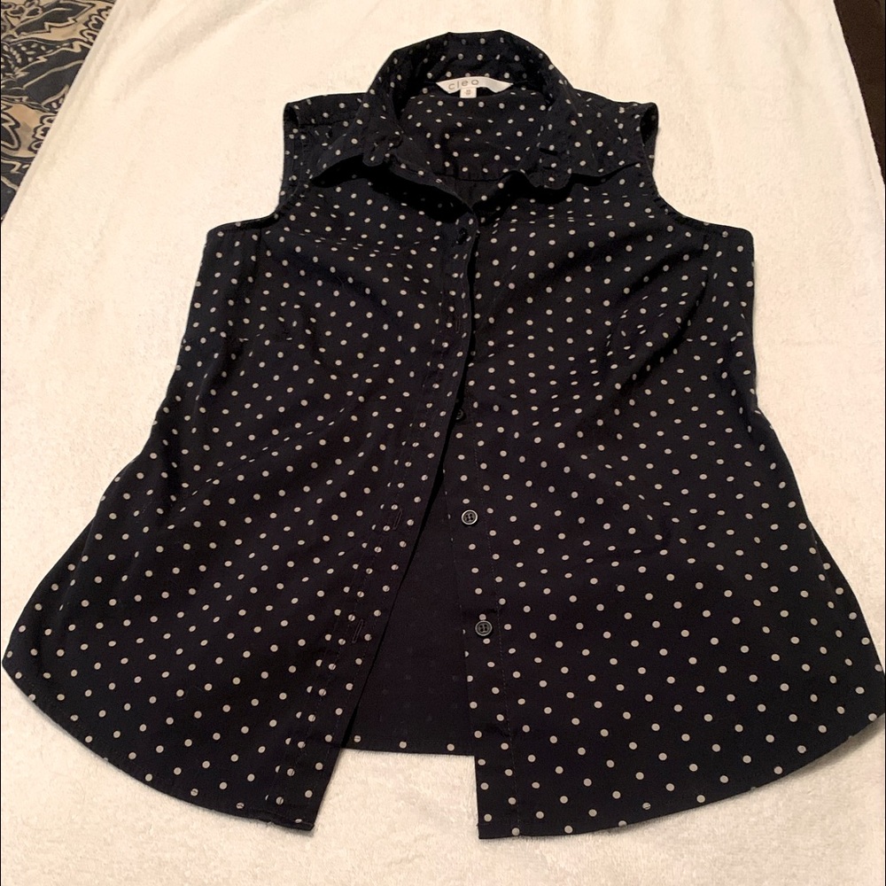 Cleo sleeveless blouse, dark navy blue with white polka dot pattern.